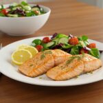 Delicious air-fryer salmon steaks served with fresh herbs and a colorful salad, a healthy and appetizing meal ready to enjoy.
