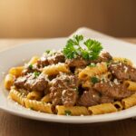Final presentation of Beef and Rotini in Garlic Parmesan Sauce, showcasing a delicious meal ready to be served with a decorative touch.