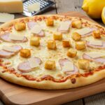 Deliciously baked Caesar Salad Pizza with fresh toppings and crisp edges, showcasing a unique take on traditional pizza that is perfect for any meal.