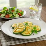 Delicious cheesy garlic zucchini steaks served on a plate, ideal for a scrumptious vegetarian meal that looks as good as it tastes.