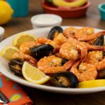 A mouthwatering classic seafood boil with fresh shrimp, crab, and colorful vegetables, perfect for sharing and enjoying.