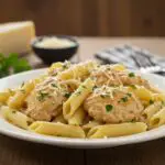 Delicious Creamy Tuscan Chicken Penne served on a plate, showcasing its creamy texture and vibrant colors.