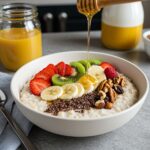 Final presentation of Egg White Oatmeal with fruits and honey, healthy breakfast bowl, vibrant and nourishing morning meal