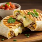 Serving a delicious grilled cheese burrito with a gooey cheese filling, perfect for a quick meal.