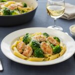 Final presentation of Chicken and Broccoli Pasta on a dinner table. Perfectly plated for an inviting meal.