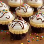 Stunning presentation of Loaded Brownie Cheesecake Cups garnished with berries and chocolate sauce, ideal for dessert inspiration.
