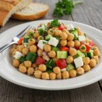 Final presentation of Mediterranean Chickpea Feta Salad, colorful healthy salad dish, Mediterranean cuisine, fresh and vibrant salad
