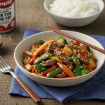 Final presentation of Minute Beef Stir Fry with colorful vegetables, garnished and served with rice, perfect for a quick and delicious meal.