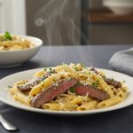 Deliciously plated One-Pot Creamy Spicy Garlic Butter Steak & Pasta ready to serve, showcasing creamy sauce and tender steak.