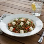 Delicious Oriental red lentil salad with feta presentation, colorful and fresh ingredients, perfect for a healthy meal.
