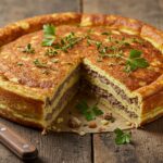 Deliciously baked pancake sausage casserole served on a table, perfect for brunch, showcasing a golden brown top and savory layers.