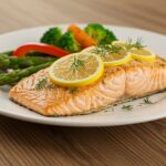Deliciously plated perfectly baked salmon with lemon and dill, presented on a rustic table, showcasing a gourmet culinary experience.