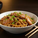 Delicious serving of Quick and Flavorful Chicken Teriyaki Noodles in a bowl, beautifully presented and ready for a meal.