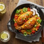Final presentation of Authentic Brazilian Coconut Chicken with vibrant garnishes, showcasing deliciousness and inviting aroma, vibrant home-cooked meal.