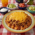 Final presentation of Cheesy Taco Rice: a delicious and colorful meal, perfect for any taco night.