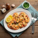 Deliciously plated Garlic Parmesan Roasted Shrimp, garnished with lemon and parsley, showcasing a perfect seafood dish.