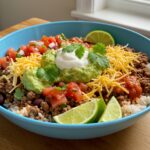 Final presentation of a ground beef burrito bowl, representing a healthy and delightful meal filled with flavors and textures, perfect for any burrito enthusiast.