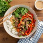 Final presentation of a Healthy Beef and Pepper Rice Bowl, highlighting the freshness and flavor of a wholesome and tasty dish.