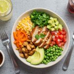 Final presentation of a healthy chicken enchilada bowl with cauliflower rice, showcasing vibrant and nutritious ingredients for a delicious meal.