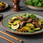 Healthy zucchini beef stir-fry served on a plate, a quick and nutritious meal option bursting with fresh flavors.