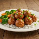 Delicious honey garlic turkey meatballs served with rice and veggies, a perfect meal for any occasion.