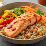 Close-up of an exquisite Honey Sriracha Salmon Bowl featuring marinated salmon, fresh vegetables, and bright garnishes for a perfect meal.