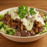 Final presentation of a Philly cheesesteak bowl, highlighting a quick and flavorful low-carb dinner that is ready to be served.